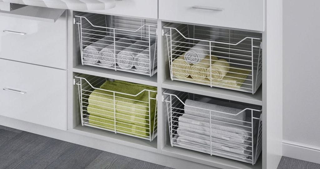 Linen closet white wire baskets design for towels and bedding by California Closets
