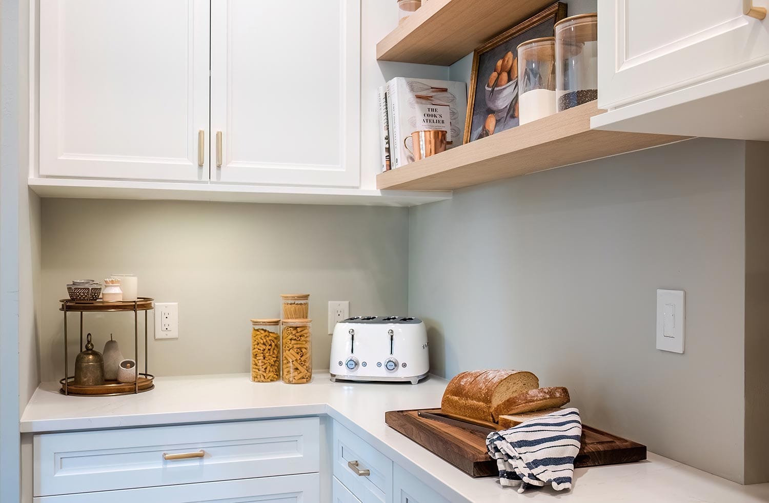 Wood pantry shelves for corner pantry with custom cabinet storage by California Closets