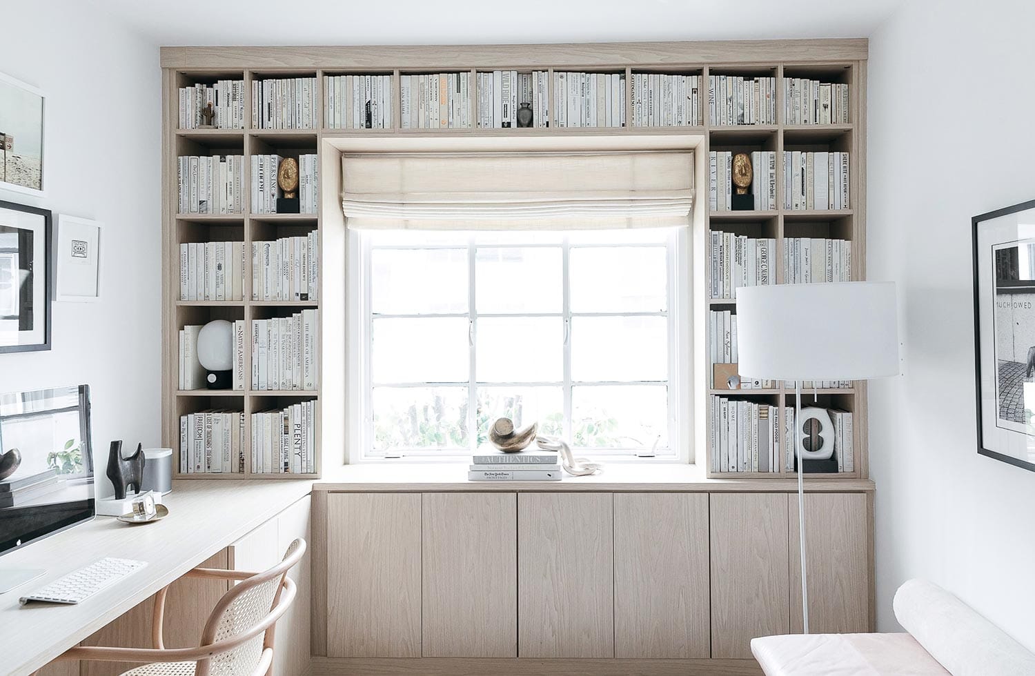 Custom home office with built in bookcase in a light wood finish California Closets