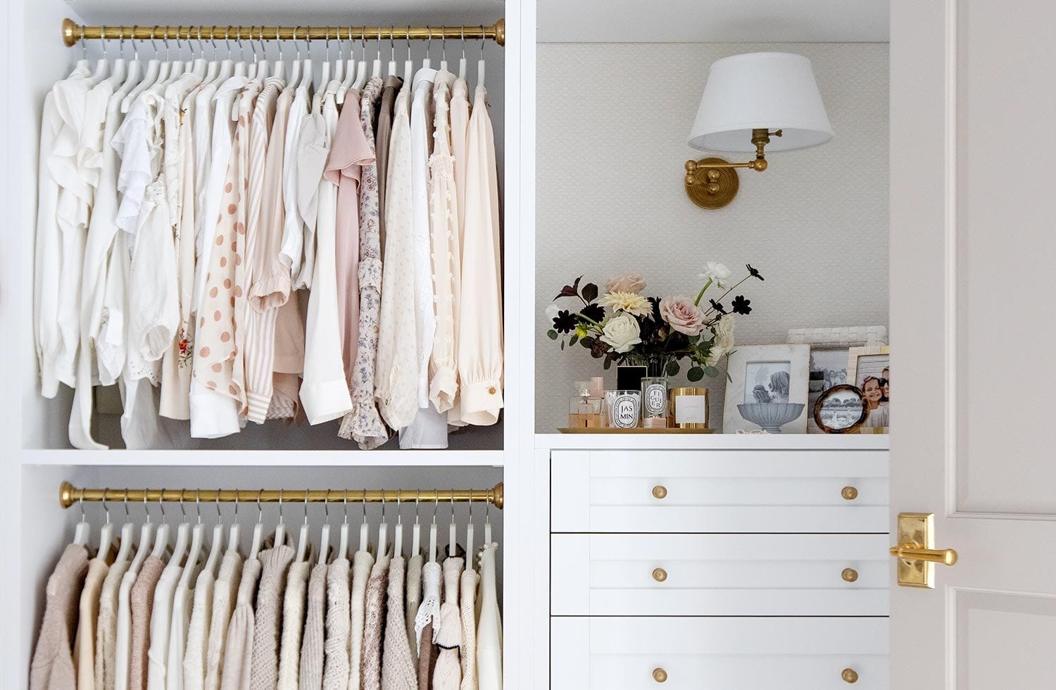 Reach in closet design with built in dresser drawers from California Closets