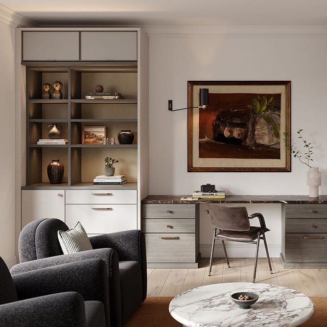 A living room space with a custom built in home office desk and shelving by California Closets