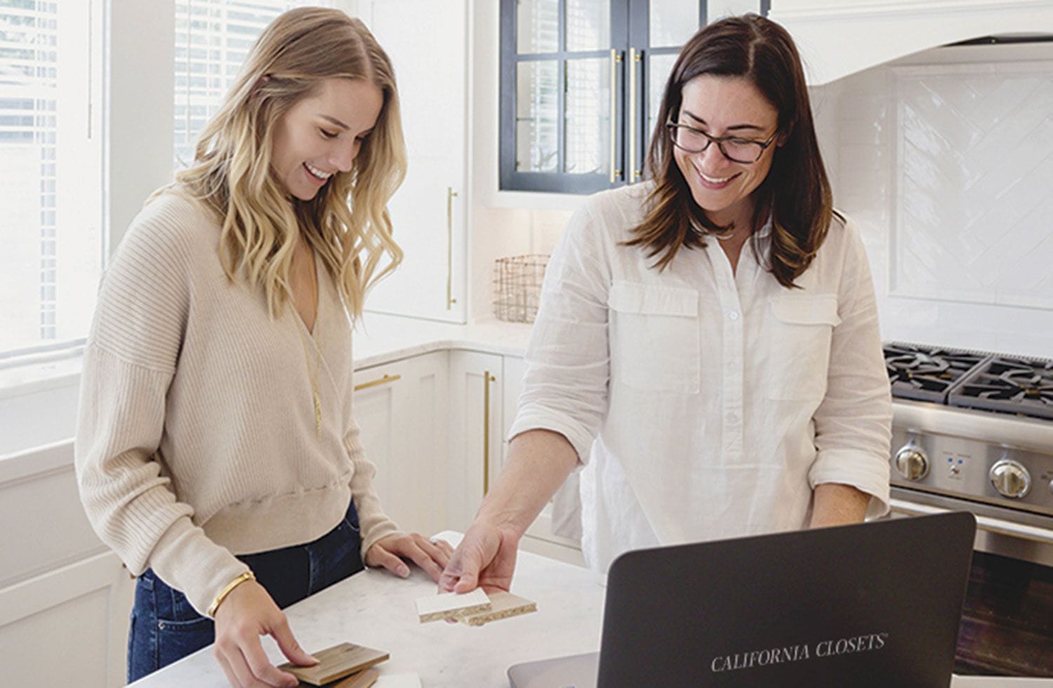 Design consultant meets with client in the home to discuss storage solutions with California Closets