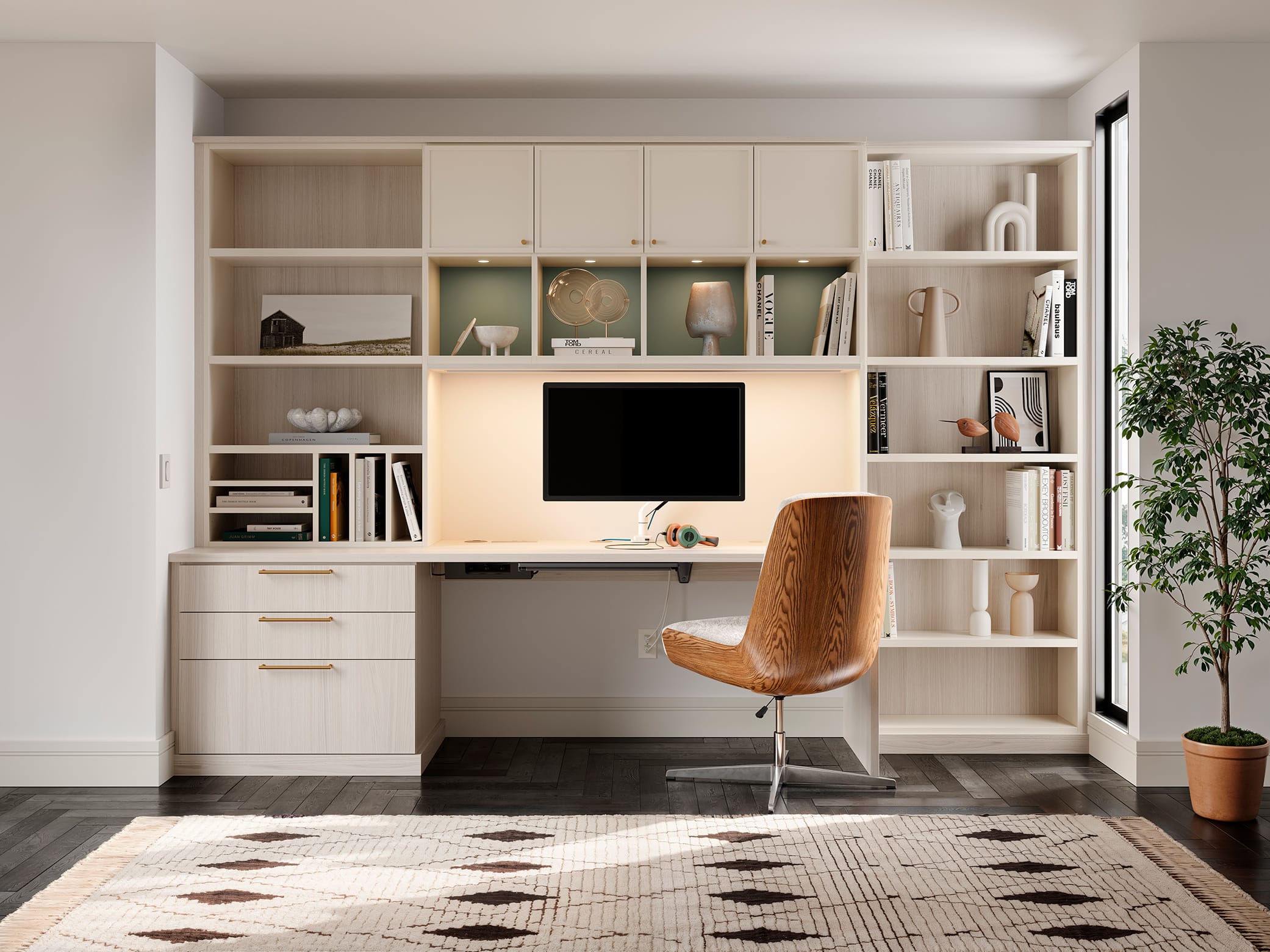 Home office desk with custom cabinetry lighted and shelving from California Closets