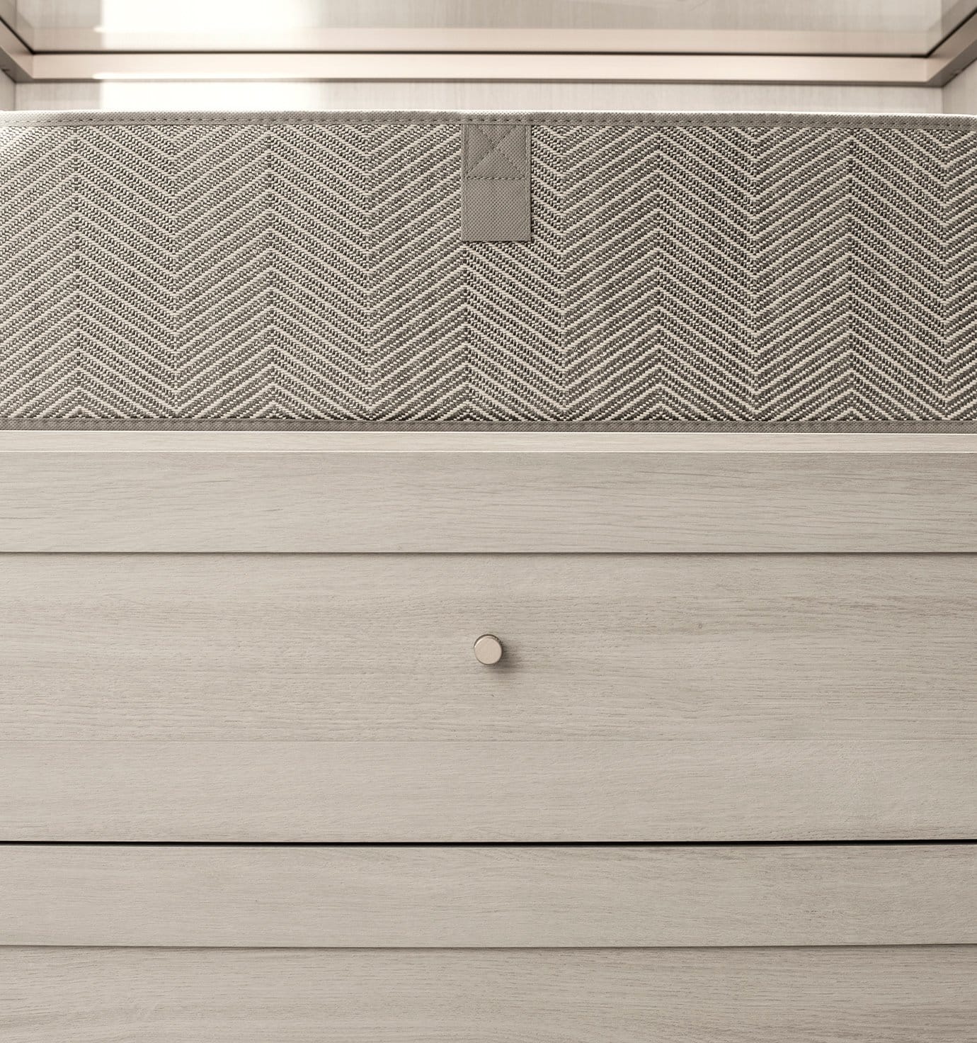 Closet drawer organizer built in design under light finish countertop by California Closets